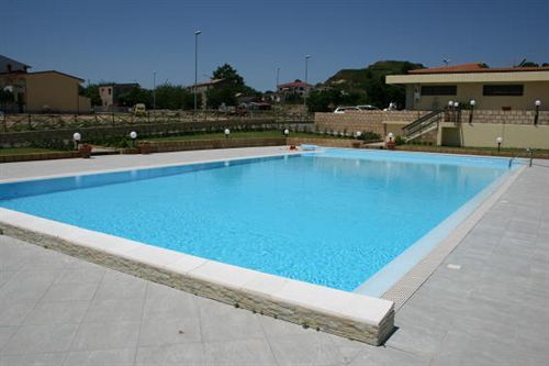 الشقق الفندقية Villaggio Le Rocelleفي  Baia Dei Canonici المظهر الخارجي الصورة